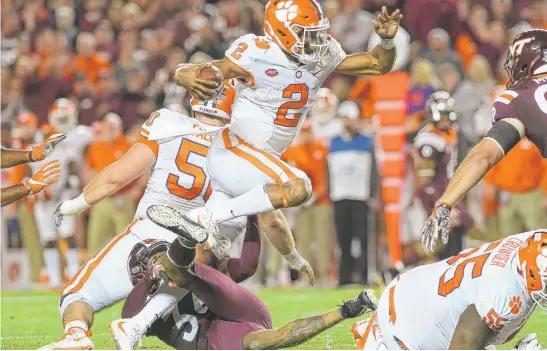  ??  ?? Quarterbac­k Kelly Bryant kept mistakes to a minimum as Clemson defeated Virginia Tech. The Tigers also have beaten Top 25 teams Auburn and Louisville. | GETTY IMAGES