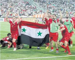  ?? AFP ?? Syria players celebrate after their match against Iran.