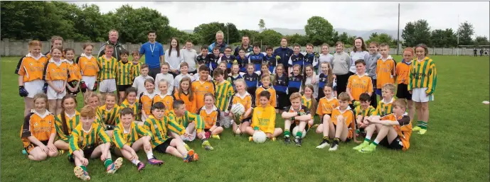  ??  ?? Gardai and teachers joined primary school children as they taok part in the annual Garda Cumann na mBhunscoil Football Blitz at Na Gael GAA grounds, Tralee on Friday morning last.