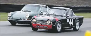  ??  ?? David Griffiths’ 1964 Triumph TR4 forces Ian Dalglish’s 1965 Porsche 911 to take a wider outside line during the Ronnie Hoare Trophy, which caters for 1963-66 sports cars.