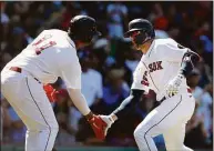  ?? Michael Dwyer / Associated Press ?? Boston Red Sox’s Enrique Hernandez celebrates his solo home run with Rafael Devers during the fourth inning against the Baltimore Orioles Sunday in Boston.