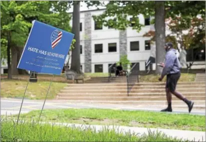  ?? RICK KAUFFMAN – DIGITAL FIRST MEDIA ?? A sign reads ‘Hate has no home here,’ at Cabrini University, which took on new meaning this weekend after racial graffiti was scrawled on door of an African-American student’s dorm room.