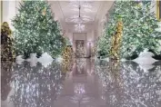  ?? ALEX BRANDON/ASSOCIATED PRESS ?? The Cross Hall leading into the State Dining Room is decorated for the season during the 2019 Christmas preview at the White House on Monday in Washington.