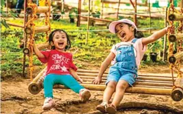  ??  ?? Happy kids at the YBF enjoy the swing.