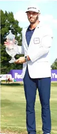  ??  ?? Dustin Johnson poses with the trophy after the final round of the FedEx St. Jude Classic at TPC Southwind on June 10, 2018 in Memphis, Tennessee. — AFP photo
