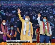  ?? ANI ?? Prime Minister Narendra Modi waves to supporters during an election rally ahead of Assam Assembly polls, in Tamulpur, Baska, on Saturday.