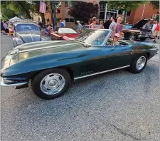  ?? IMAGE FROM SCREENSHOT ?? This image shows a car on display at the Red Horse Motoring Club’s downtown Pottstown car show on Aug. 1. Few masks are evident among those attending.