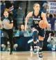  ?? HOOLEY/AP ERIN ?? Uconn guard Nika Mühl dribbles the ball during the first half against Depaul on Saturday in Chicago.