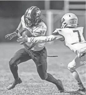  ?? JEFF FAUGHENDER/COURIER JOURNAL ?? Atherton running back Micheal Curry scored three touchdowns as the Ravens defeated Fairdale 24-6 to clinch the 5A, District Three title on Friday.