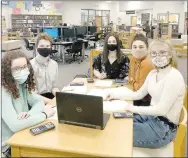  ?? COURTESY PHOTO ?? This year’s Academic Competitio­n in Education season is being held virtually through the Zoom video app. Prairie Grove High School’s team includes Olivia Thompson, Sawyer Myane, Ella Nations, Landin Madewell and Emma Hannah. They were in the school library for their virtual match against Farmington last week. Other team members are Jeryn Carter and Millie Whitney.