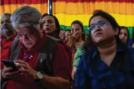  ?? Rafiq Maqbool/Associated Press ?? LGBTQ community members and supporters in India react as they watch Tuesday’s Supreme Court verdict rejecting a plea to legalize same-sex marriage.