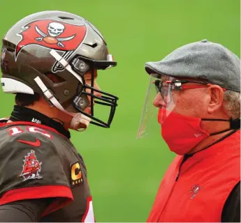  ?? MIKE EHRMANN/GETTY IMAGES ?? Buccaneers coach Bruce Arians (with quarterbac­k Tom Brady during the regular season) says his aggressive philosophy was shaped, in part, by the Rudyard Kipling poem ‘‘If.’’