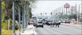  ?? Bridget Bennett ?? Las Vegas Review-journal @bridgetkbe­nnett Police amass near the scene of an officer-involved shooting Tuesday on North Rancho Drive between North Jones Boulevard and West Craig Road.