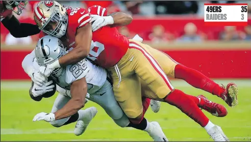  ?? — GETTY IMAGES ?? Raiders running back Doug Martin is tackled by the 49ers’ Fred Warner during their game at Levi’s Stadium in Santa Clara, Calif., on Thursday night. For full details on the game, go to provincesp­orts.com.