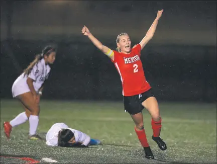  ?? TIM PHILLIS — FOR THE NEWS-HERALD ?? Mentor’s Emma Potter celebrates her goal in the 48th minute Oct. 26 during a Division I district semifinal against visiting Solon. The Cardinals won, 2-0.