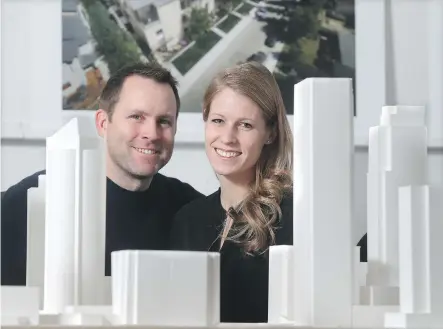  ?? TED RHODES ?? Laura and Jesse Hindle, principals at Hindle Architects, with a model of the west end of downtown Calgary in front of them at their Currie Barracks offices. The pair have become involved in a wide range of projects since locating to Calgary.