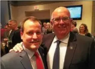  ?? PAUL POST — PPOST@DIGITALFIR­STMEDIA.COM ?? Saratoga County Clerk Craig Hayner, left, and Sheriff Mike Zurlo were all smiles Tuesday night at the Holiday Inn in Saratoga Springs. The two Republican­s were unopposed in their bids for re-election.