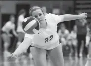  ?? NWA Democrat-Gazette/CHARLIE KAIJO ?? Harrison High School’s Ella Kate Reynolds (22) digs during a championsh­ip match of the 4A-1 Conference volleyball tournament Thursday at Pea Ridge High School in Pea Ridge. Harrison defeated Shiloh Christian High School in three straight sets.