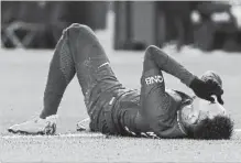  ?? ASSOCIATED PRESS FILE PHOTO ?? Paris-Saint Germain superstar forward Neymar lays on the soccer pitch during a match against Marseille on Sunday.