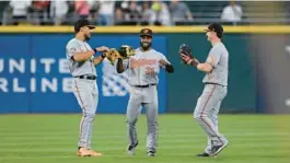  ?? BEATY/AP PAUL ?? From left, Anthony Santander, Cedric Mullins and Austin Hays, pictured celebratin­g after a win last season, are expected to be starting in the Orioles outfield again in 2023.