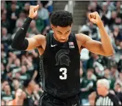  ?? CARLOS OSORIO — THE ASSOCIATED PRESS ?? Michigan State guard Jaden Akins reacts after the win over Illinois after the second half of a game earlier this month in East Lansing. The Farmington High grad could be an X-factor for MSU down the stretch.