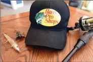  ?? NWA Democrat-Gazette/FLIP PUTTHOFF ?? Bass Pro Shops caps, such as this one that’s similar to ones sold in the 1970s, may be purchased today.