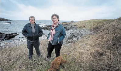  ?? PAUL DALY THE CANADIAN PRESS ?? Wanda Crocker, left, and Gerry Rogers live in Broad Cove, N.L., where about 30 lesbians have been settling or summering for the past three decades.