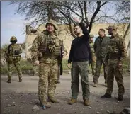  ?? (AP/Ukrainian Presidenti­al Press Office) ?? Ukrainian President Volodymyr Zelenskyy talks with a commander Tuesday at a position in Avdiivka in the Donetsk region of eastern Ukraine. More photos at arkansason­line.com/419troops/.