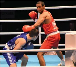  ??  ?? India’s Ashish Kumar (right) stuns fourth seed Bekzhigit Uulu Omurbek of Kyrgyzstan 5-0 to reach the quarte finals of Olympic Qualifiers in Jordan.