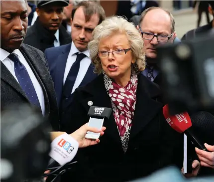  ??  ?? >
Justice4th­e21 campaigner Julie Hambleton (centre) speaks to the media outside the Civil Justice Centre