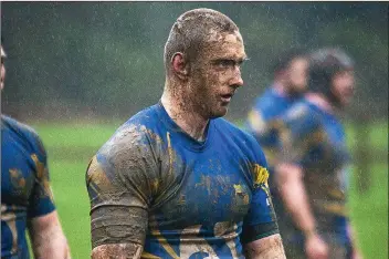  ??  ?? A muddied Conor Parsons during the annual Rathdrum versus Houndogs game.