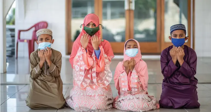  ?? Photo: Leon Lord ?? Eid Mubarak…….Siblings (F/L) Mohammed Noor Qasim , Zahra Sumbu, Maria Siddiqah and Mohammed Azizullah Qasim celebrate Eid Mubarak at the Toorak Jame Masjid in Suva on May 12 2021.