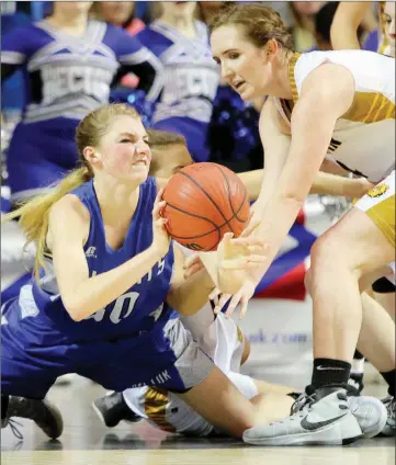  ?? FILE PHOTO ?? Hector’s Whittney Bell, left, tries to pass from the ground under pressure from Quitman’s Reagan Rackley during the Class 2A state-championsh­ip game in Hot Springs last March. Bell is a senior on this year’s Hector squad.