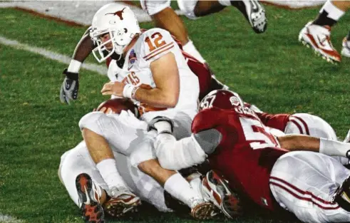  ?? Associated Press ?? Texas quarterbac­k Colt McCoy’s injury early in the 2010 Rose Bowl put the wheels in motion for the Longhorns’ decade-long decline.