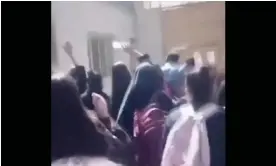  ?? Photograph: Handout ?? Schoolgirl­s in Iran drive an official away from a school, chanting ‘Bisharaf!’ – a grave insult in Farsi that means ‘shameless’ or ‘dishonoura­ble’.