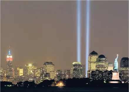  ?? MICHAEL DABIN/NEW YORK DAILY NEWS ?? The Memorial in Light is illuminate­d on the second anniversar­y of the Sept. 11, 2001, attacks on the World Trade Center.