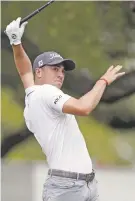  ?? ERIC GAY/THE ASSOCIATED PRESS ?? Justin Thomas loses control of his club as he hits his tee shot on the eighth hole Saturday at the Match Play in Austin, Texas.