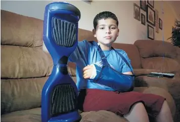  ?? CARLINE JEAN/STAFF PHOTOGRAPH­ER ?? Matthew Perez, 10, was hurt while riding a hoverboard he received from his grandparen­ts as a Christmas gift.