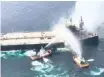  ?? | EPA-EFE ?? COASTGUARD fireboats try to extinguish the fire on the Panama-flagged oil tanker, the New Diamond, off the east coast of Sri Lanka, yesterday.