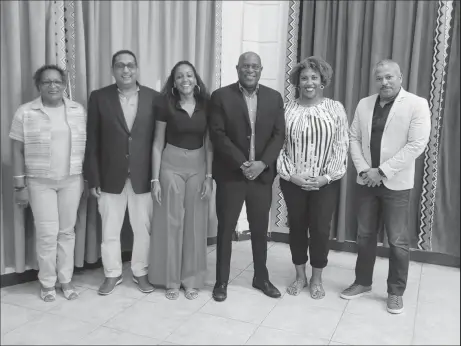  ?? ?? Director of Sport Steve Ninvalle (3rd from right) posing with officials and counterpar­ts from Suriname and French Guiana following the confirmati­on of the 2024 IGG