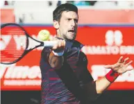 ?? KIM KYUNG-HOON / REUTERS ?? Serbian Novak Djokovic has advanced to at least the semifinal round in his past seven tournament­s dating to the Madrid Open in May.