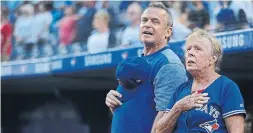  ?? STEVE RUSSELL/TORONTO STAR ?? Blue Jays manager John Gibbons and his mother Sallie stand for the anthems before Friday’s Jays-Yankees game. Sallie Gibbons threw out the first pitch.