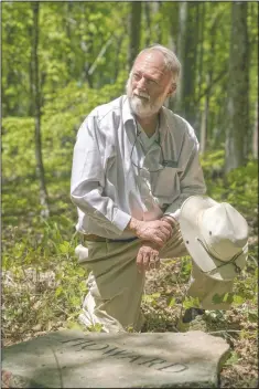  ??  ?? Ralph Howard pauses at his headstone. Green burials represent a very small but growing segment of America’s funeral industry.