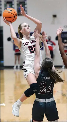  ?? (Special to NWA Democrat-Gazette/Brian Sanderford) ?? Pea R idge Lady B lackhaw k senior Blakelee Winn (22) shoots as Morrilton’s Allison Dunlap (24) defends on Saturday in Ozark during the 4A North Regional tournament championsh­ip game. Morrilton won the game 46-39 in overtime.