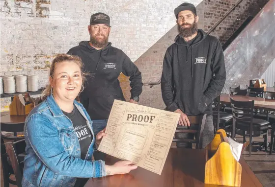  ?? Picture: Nev Madsen. ?? NOW OPEN: Happy to see Proof in Duggan St open its doors are (from left) Stephanie Edmondson, Ryan Lane and Luke Pitman.