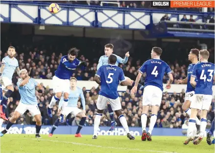  ?? — AP ?? Manchester City’s Aymeric Laporte (centre), scores against Everton in their EPL match at Goodison Park in Liverpool on Wednesday.