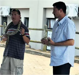  ?? ?? Snake handlers Danie Nel and Peter Daniel gave a snake awareness demonstrat­ion