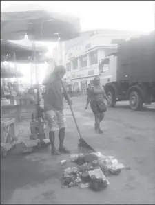  ??  ?? A vendor doing his part during yesterday’s exercise