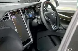  ??  ?? Standard Tesla stuff: enormous 17-inch touch-screen, very expensive optional leather/Alcantara upholstery.