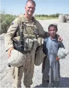  ?? CAPT. BRIAN HUYSMAN ?? Frank Biggio and Ishmael in Helmand province, Afghanista­n, in 2009.